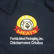 Embroidered logo on a navy work polo for A&A Meats — Florida Meat Packaging.