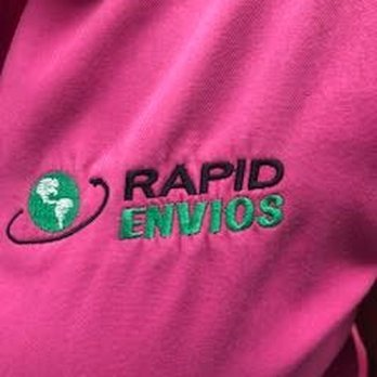 Embroidered Rapid Envios logo on a hot-pink polo.